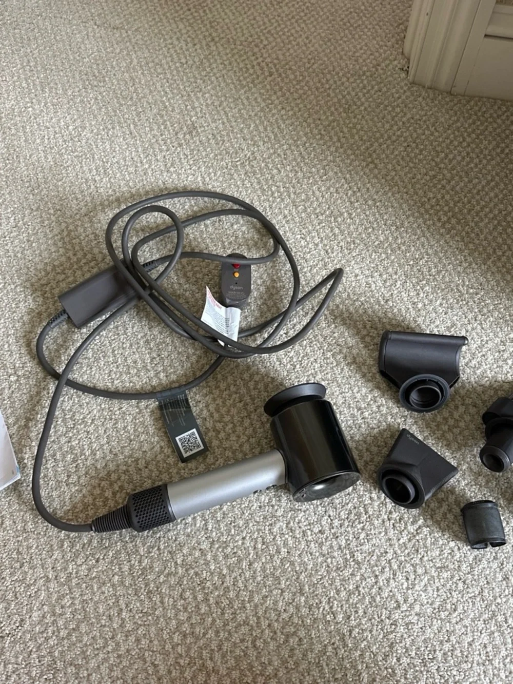 Dyson Black and Silver Hair Dryer with Multiple Attachments